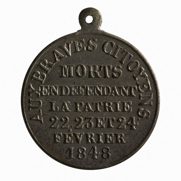 Bronzene Medaille mit der Aufschrift "Braves City Morts" vor einem weißen Hintergrund.