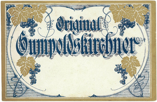 Ein altes deutsches Weinlabel mit einer Illustration von Trauben und Blättern und einem Text, der den Weintyp angibt.