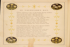 Ein aufgeschlagenes Buch mit einem Gedicht namens 'St. Valentinstag' von Philip Phillips, umgeben von einem dekorativen Blumenrand.